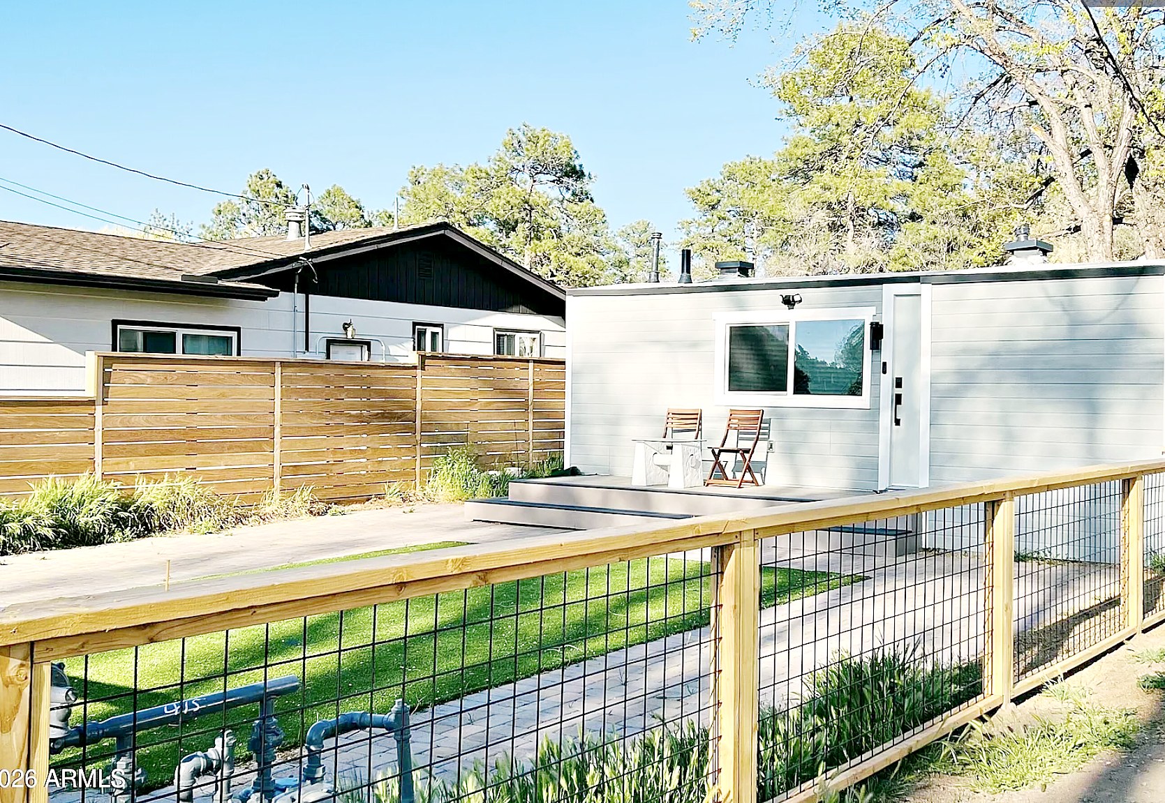 Front exterior with deck and fence